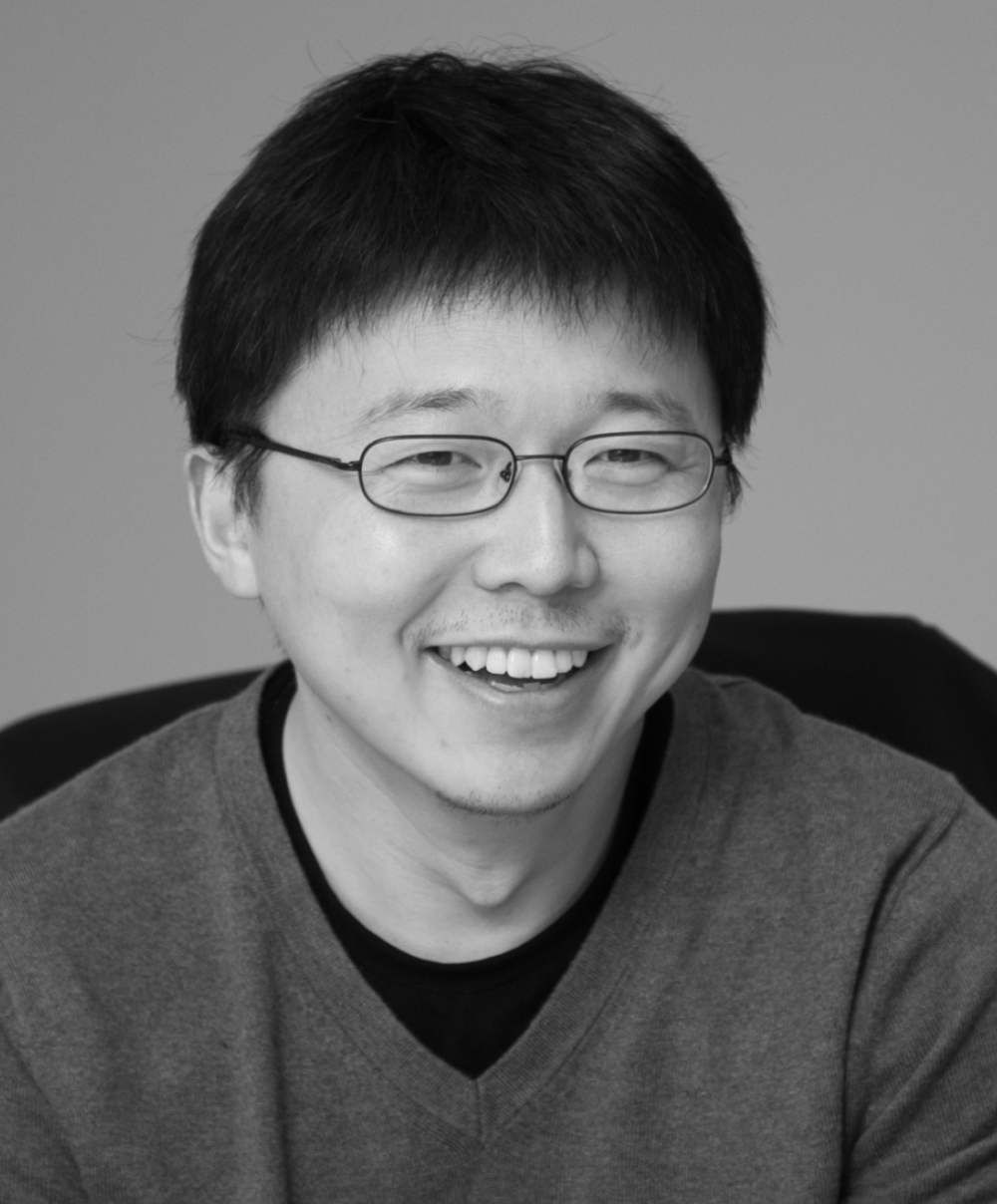 Black and white head shot of biochemist Feng Zhang