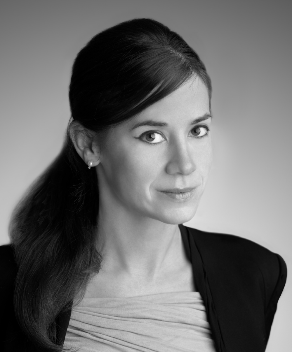 Black and white head shot of neuroscientist and technologist Poppy Crum