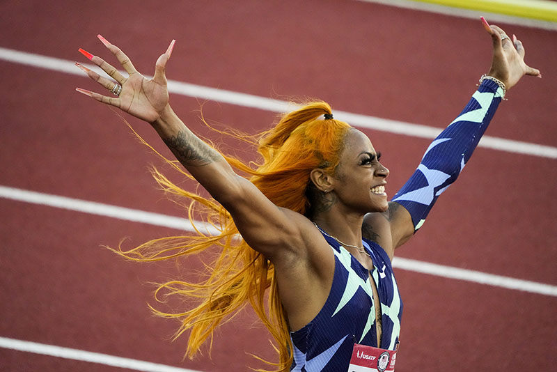 A picture of Sha'Carri Richardson celebrating after winning her 100-meter running Olympic trial.