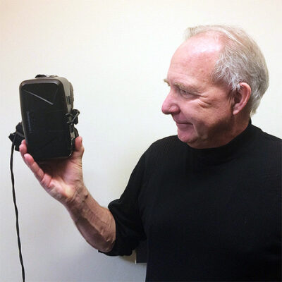 A candid picture of Walter holding a head mounted device.