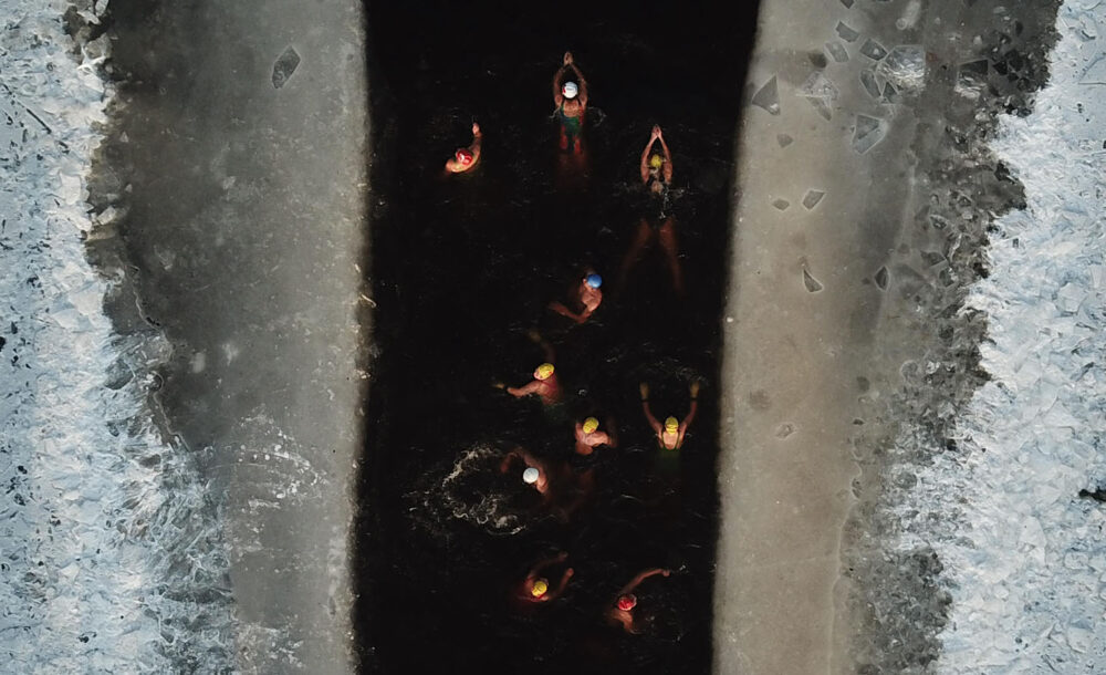 An aerial photograph of women swimming.