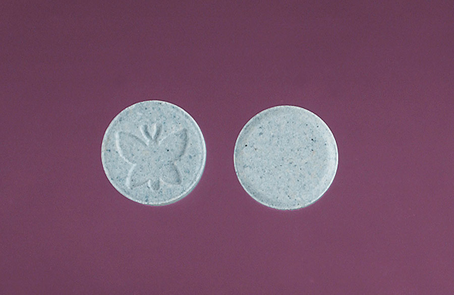 A photograph of tablets of psychoactive substance MDMA. 